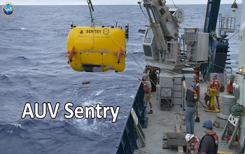Autonomous Underwater Vehicle SENTRY being lowered into the ocean.